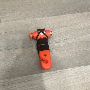 Orange window breaker/seat belt cutter